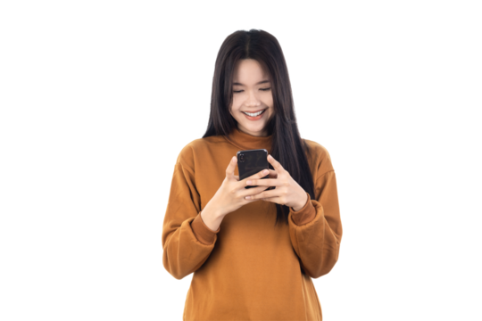 Portrait of a smiling casual Asian woman holding smartphone isolated on white background with clipping path.