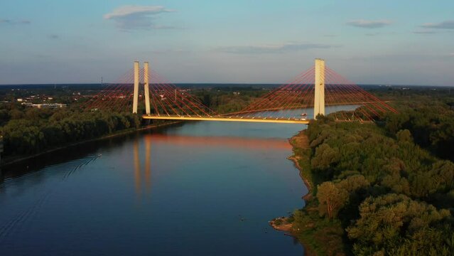 Aerial view of Siekierkowski bridge and Wisla Vistula river at sunset.