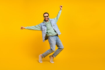 Fototapeta na wymiar Full body size cadre of funky crazy cheerful macho playful dance have fun tiptoes have fun positive isolated on yellow color background