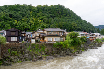 Fototapeta na wymiar Gujo Hachiman , small riverside castle town during rainy day at Gujo Hachiman Gifu , Japan : 30 August 2019 .
