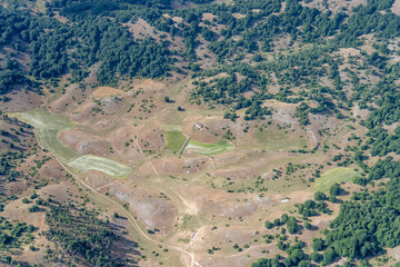 fields and woods on Rascino upland aerial, Italy