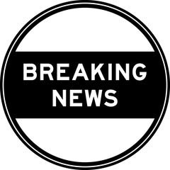 Black color round seal sticker in word breaking news on white background
