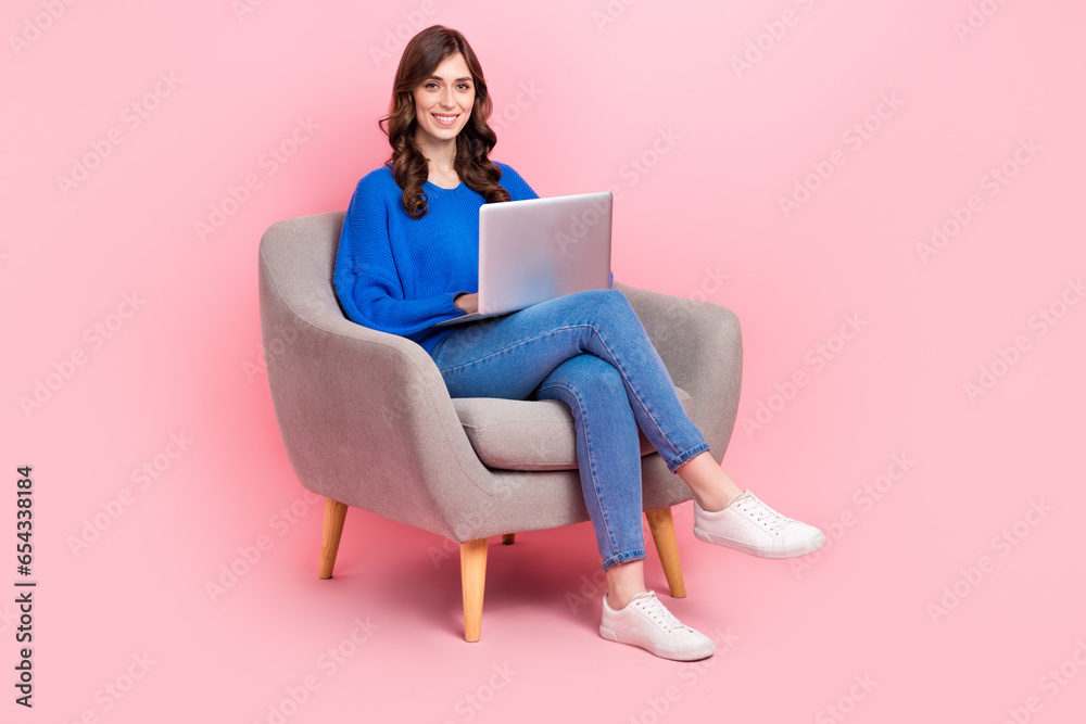 Poster Full body portrait of pretty positive lady sit comfort soft chair use netbook coworking isolated on pink color background