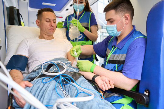 Mobile team doctor giving an injection to a patient