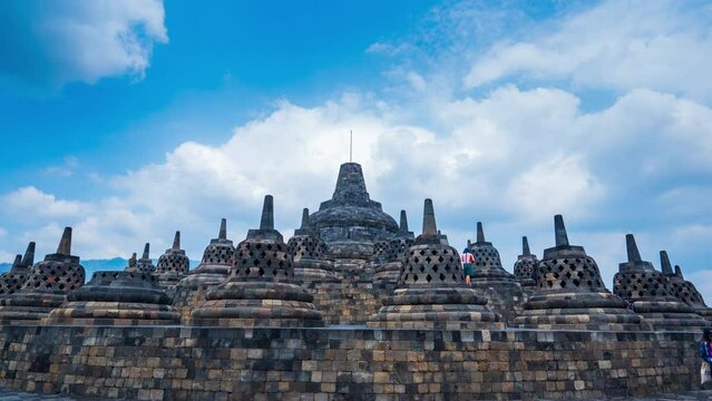 Timelapse of Borobudur, a 9th-century Mahayana Buddhist temple in Magelang Regency Yogyakarta in Java, Indonesia, Zoom in