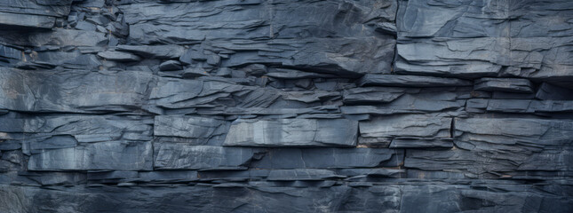a close up of a rock wall in the style of dark sky-blue and light gray