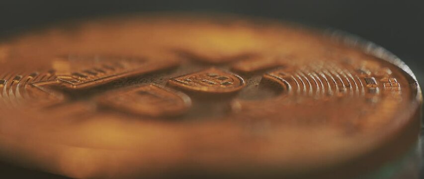 Detailed close-up shot over golden bitcoin cash coin; fire flames on the coin