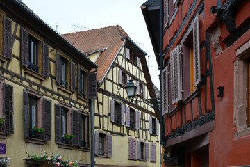 Fototapeta na wymiar half-timbered houses in narrow street in the old town of Ribeauville in Alsace 