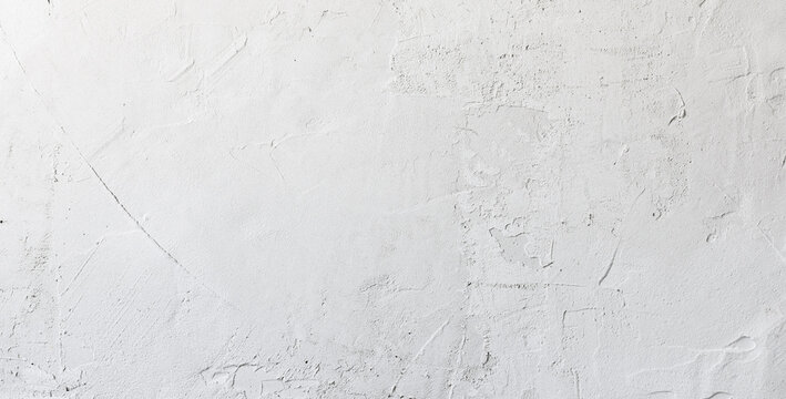 Close up of texture white putty or plaster on the wall, creating a smooth and clean surface for interior finishing.