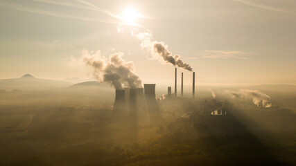 aerial view of coal fired power station and Combined cycle power plant at sunset, Pocerady, Czech...