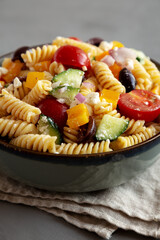 Homemade Organic Greek Pasta Salad in a Bowl, side view.
