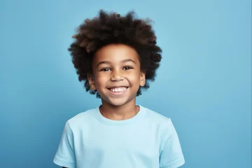 Fotobehang Happy African American Boy Portrait on Blue Background. Smiling Face of a Young Black Child © Alona