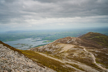 Rock wall, vegetation and stream at Croagh Patrick mountain, Westport, Ireland