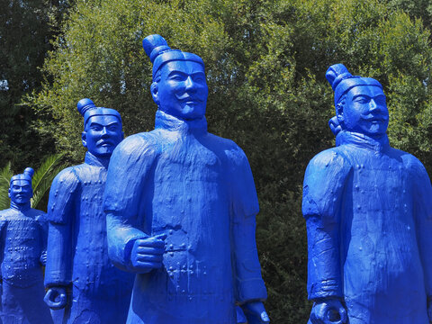Collection of terracotta sculptures in the Bacalh&ocirc;a Buddha Eden park. Blue painted copies of Terracotta Army depicting the armies of Emperor Qin Shi Huang. Quinta dos Loridos, Portugal.