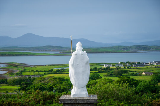 White statue of Saint Patrick at the start of foot path to the peak of Croagh Patrick, county Mayo, Ireland