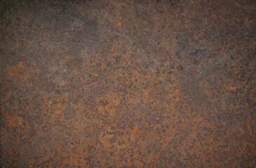Photo of the texture of a metal rusty wall. Rusty iron background. The spread of corrosion on the...