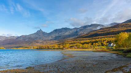 autumnal panorama in the mountains on the island of Kvaløya, in Troms, Norway. glacial valley with...