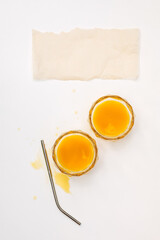 Two glasses of orange juice.