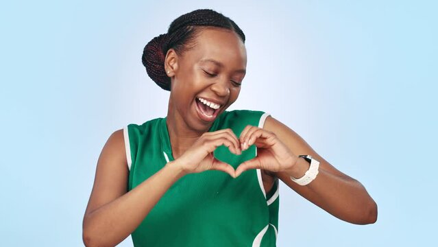 Woman, happy and pointing at you with love in studio on blue background with mockup for sports. Black, person and smile in excitement for game, training or practice with portrait for appreciation