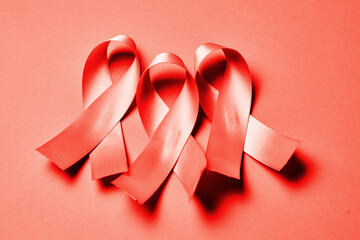 AID red ribbon a symbol of the fight against HIV, AIDS and cancer.