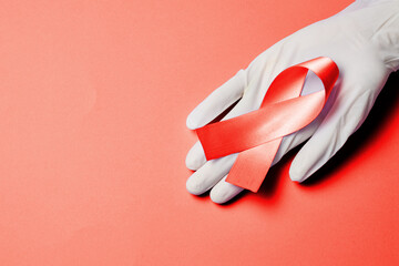 AID red ribbon a symbol of the fight against HIV, AIDS and cancer.