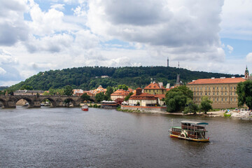 Obraz premium View at Vltava river and Charles Bridge in summer. Prague, Czech Republic. 