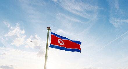 Flag of North Korea waving in the wind, sky and sun background. North Korea Flag. Ultra Hd.