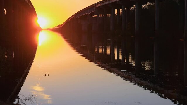 Atchafalaya swamp bridge at sunset in Louisiana.