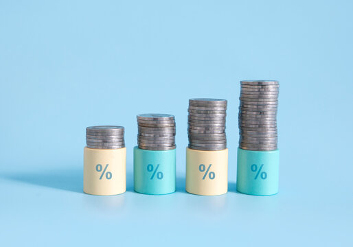 stack of coins with financial interrest rates hikes graph , inflation crisis 