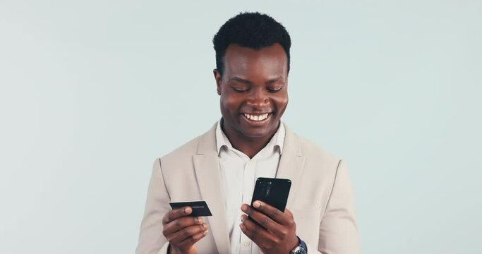 Credit card, smile and and black man with phone in studio for banking, membership or invest on white background. Ecommerce, payment and African guy model with smartphone app for cashback offer