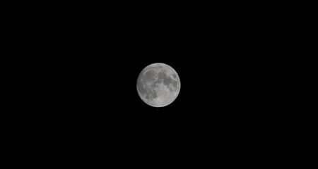 Super full moon with dark background. Madrid, Spain, Europe. Horizontal Photography.