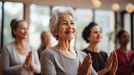 Elder mature women doing yoga classes. Pilates, wellness and group of senior women doing a mind,...