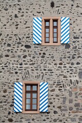 window with shutters of the wall of an old castle