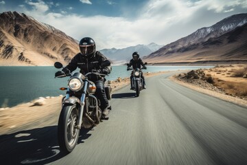 Indian bikers at Ladakh India traveling on a national highway road with a scenic landscape