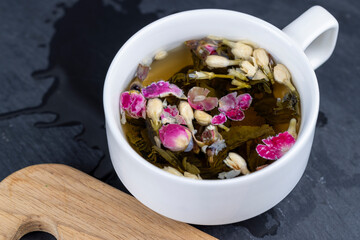 green tea with rose and jasmine flowers
