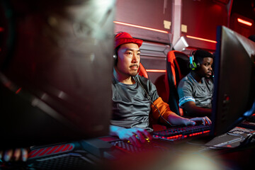 Professional male gaming team participating in a eSport tournament