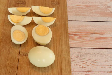 Boiled eggs on the background of wooden boards