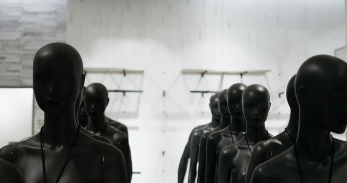 Black mannequins positioned, ready to showcase clothing in retail environment. how mannequins in store enhance fashion presentations world of mannequins in store, prepped for vibrant displays.