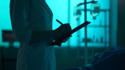 Close-up detail shot of an unrecognisable woman, nurse, female doctor checking up on her patient...