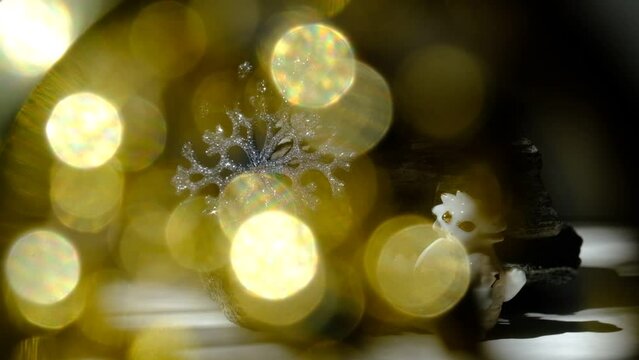 Chinese New Year decorations with  cute figurine baby Dragon and glittering silver snowflake. Glowing blurred flares light. String lights, Atmospheric mood
