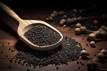 Fotobehang Wooden shovel sprinkled with black peppercorn © The Big L