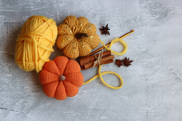 Autumn crocheting ideas. Cute crocheted amigurumi toys, wool yarn, crochet hook. Space for text. 