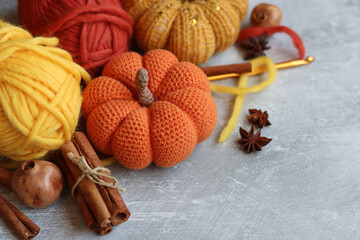 Autumn crocheting ideas. Cute crocheted amigurumi toys, wool yarn, crochet hook. Space for text. 