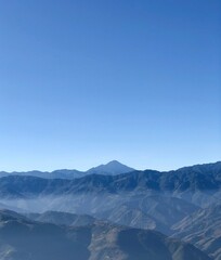 Far volcano in blue