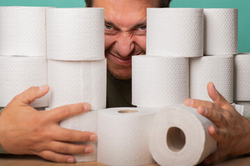 A greedy man hides in toilet paper supplies.