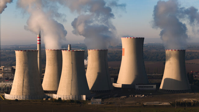 aerial view of coal fired power station and Combined cycle power plant at sunrise, Pocerady, Czech republic