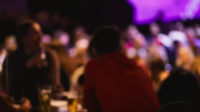 Friends and festivities: A lively bar scene filled with laughter and fun defocused