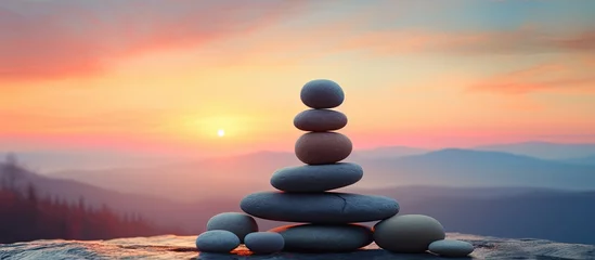 Fototapeten Zen stones on sunrise sky background with full moon © TheWaterMeloonProjec