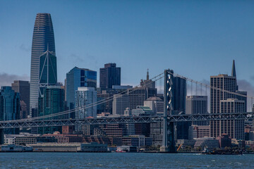 View from water of the San Francisco Bay Bridge in front of the Embarcadero and SF skyline on a clear day