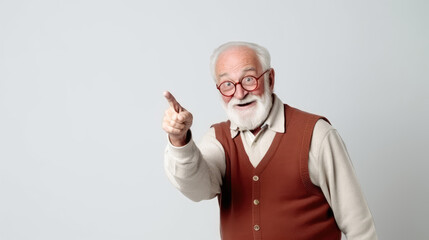 Old happy man with beard posing in the studio